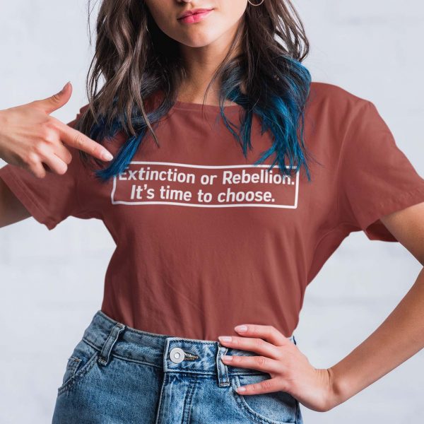 woman wearing a t-shirt that says Extinction or Rebellion It's time to choose.